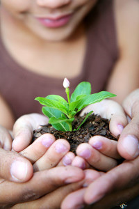 Girl Holding Plant